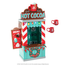 Load image into Gallery viewer, The Elf on the Shelf Insta-Props 2-in-1 Scene Kit - Hot Cocoa Stand and Magic Shrinking Machine Scenes